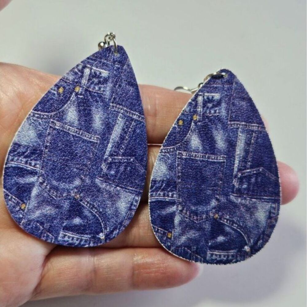 Teardrop shaped blue jean themed earrings
